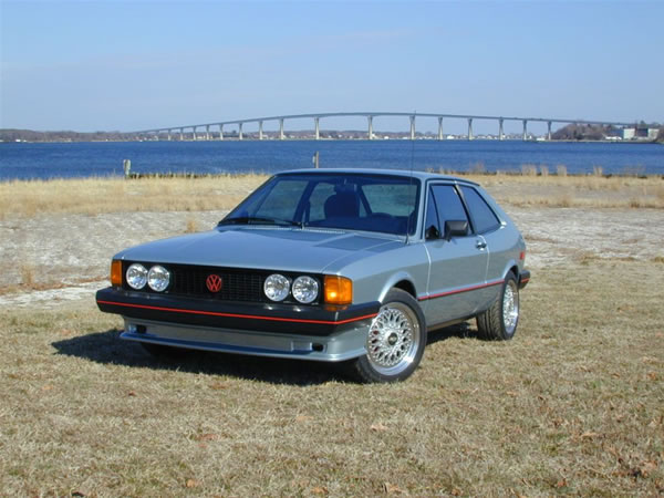 Brian's 1981s VW Scirocco sitting on the beach at his house